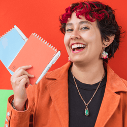 girl-showing-her-erasable-stone-paper-notepads