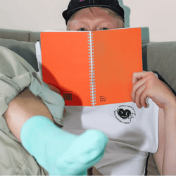 guy-looking-over-a-solid-elegance-erasable-notebook