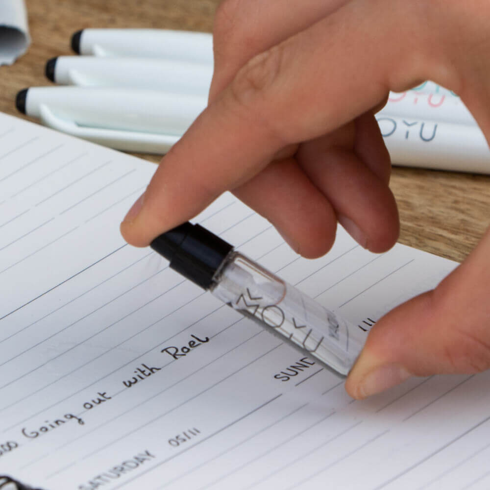 moyu-mini-spray-being-used-to-erase-ink-from-stone-paper