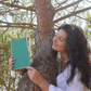 Girl showing A5 Forest Green erasable notebook
