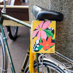 nature-on-rocks-flower-vibes-notebook-on-a-bike